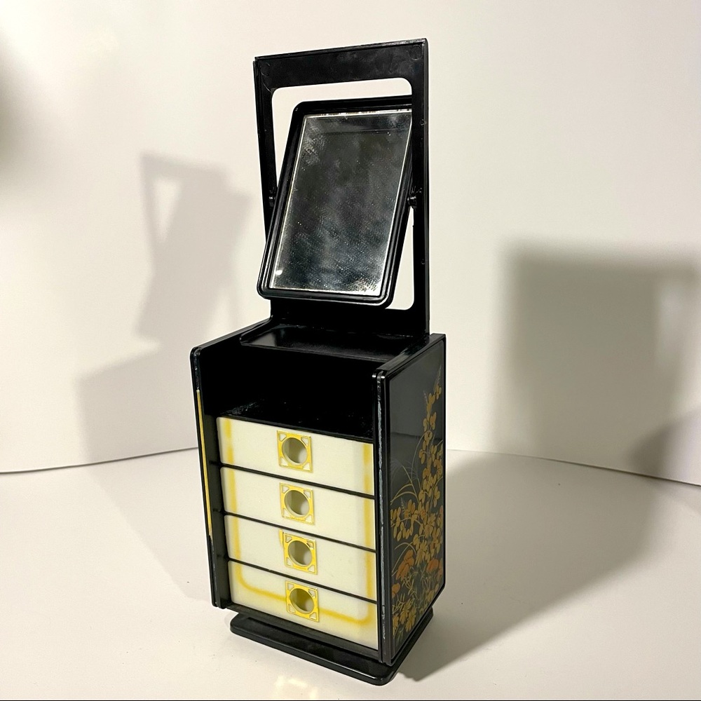 Vintage plastic jewelry dresser chest opens with swivel mirror and drawers
